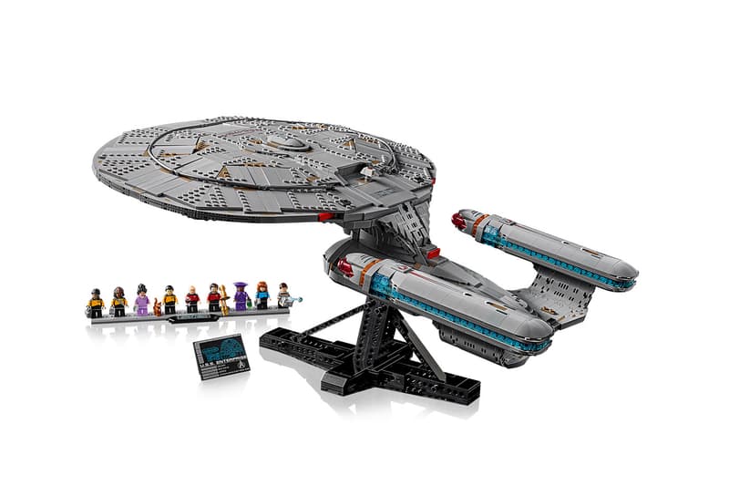 LEGO Icons Star Trek: U.S.S. Enterprise NCC-1701-D with nine TNG minifigures arranged on an angled display stand