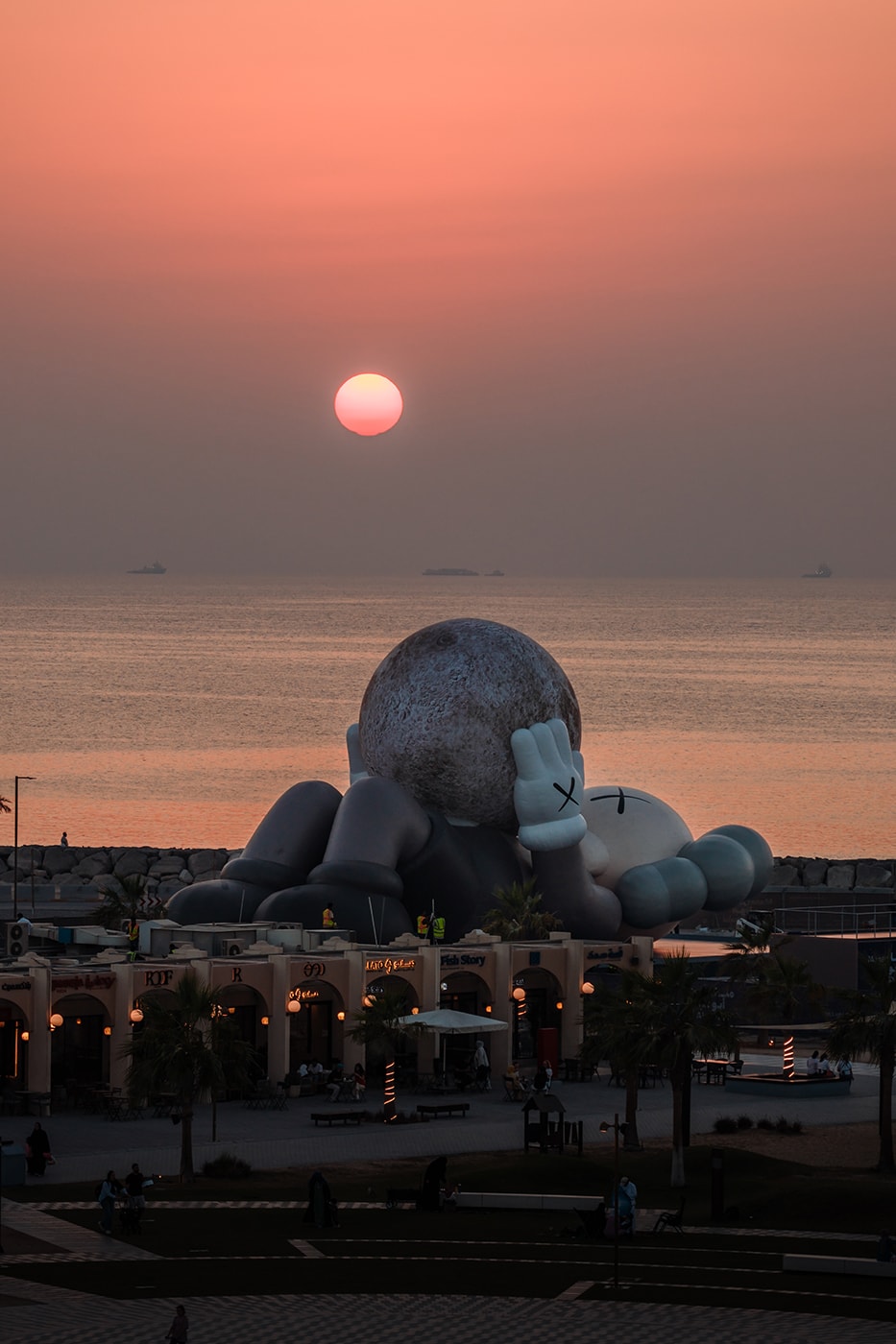 KAWS:HOLIDAY Lands in Abu Dhabi uae souq al mina companion sculpture allrightsreserved arr