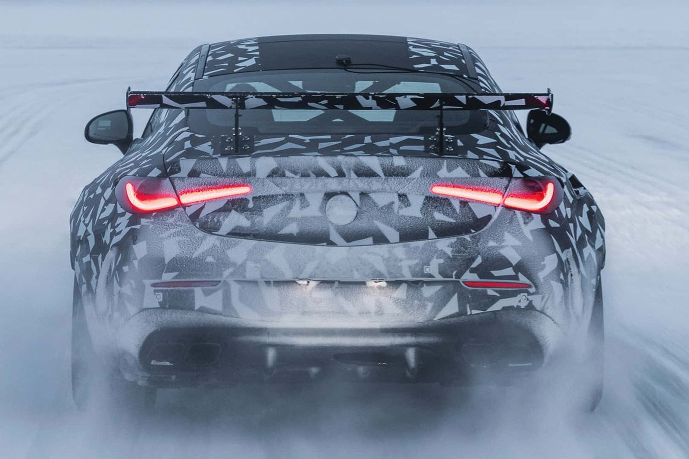 Camouflaged Mercedes-AMG Mythos CLE prototype with wide body, big rear wing and V8 undergoing cold-weather testing in Sweden