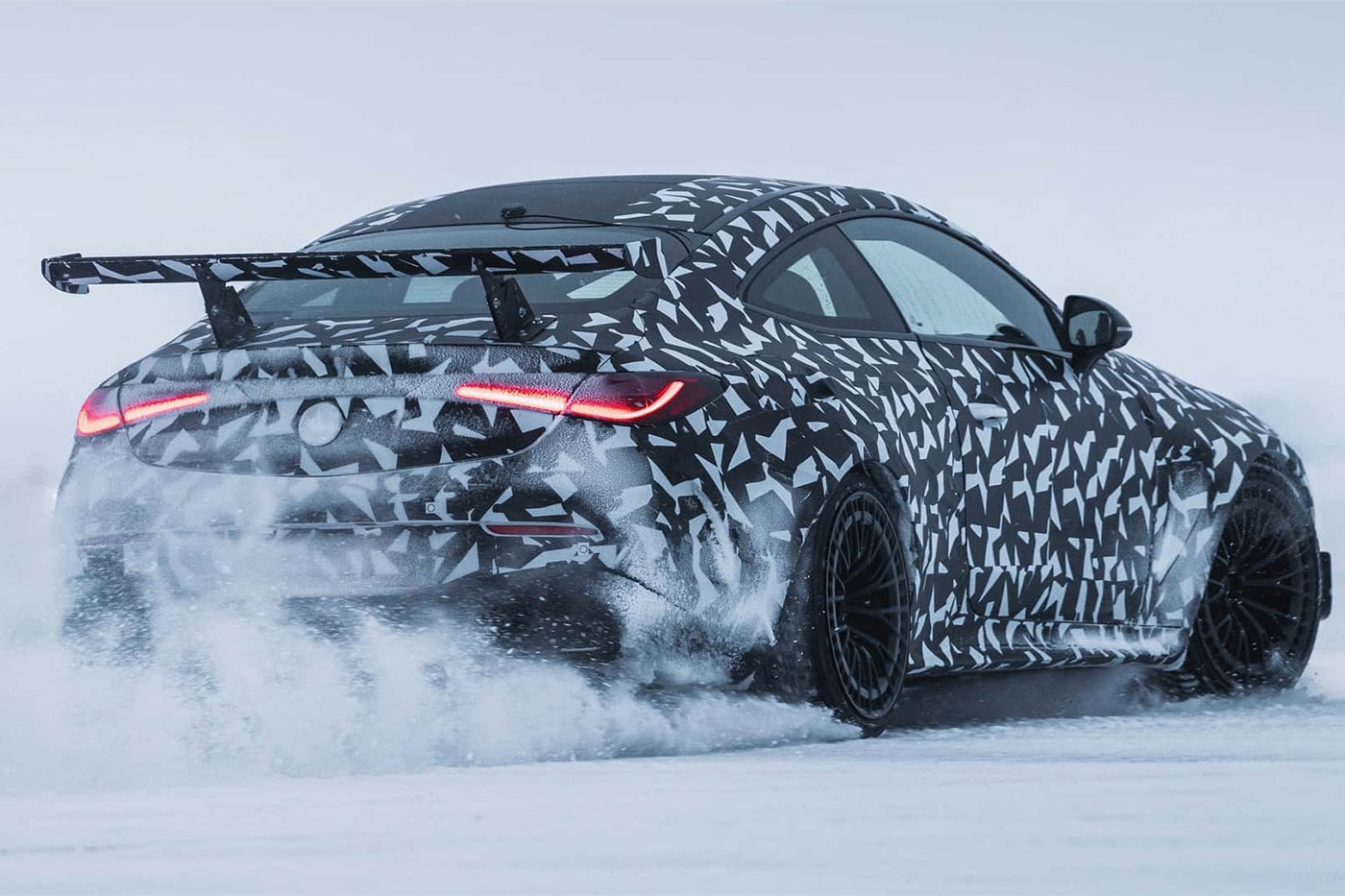 Camouflaged Mercedes-AMG Mythos CLE prototype with wide body, big rear wing and V8 undergoing cold-weather testing in Sweden