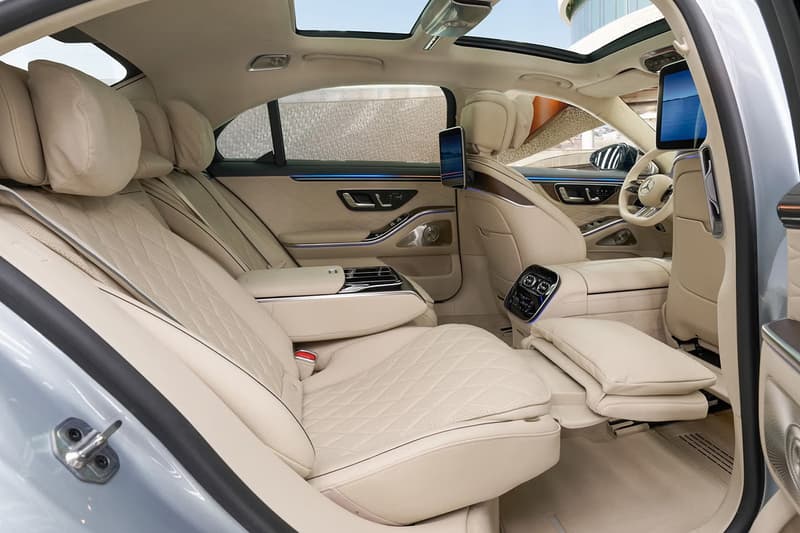 2027 Mercedes-Benz S-Class showcasing illuminated grille and triple-screen MBUX Superscreen interior with MB.OS supercomputer