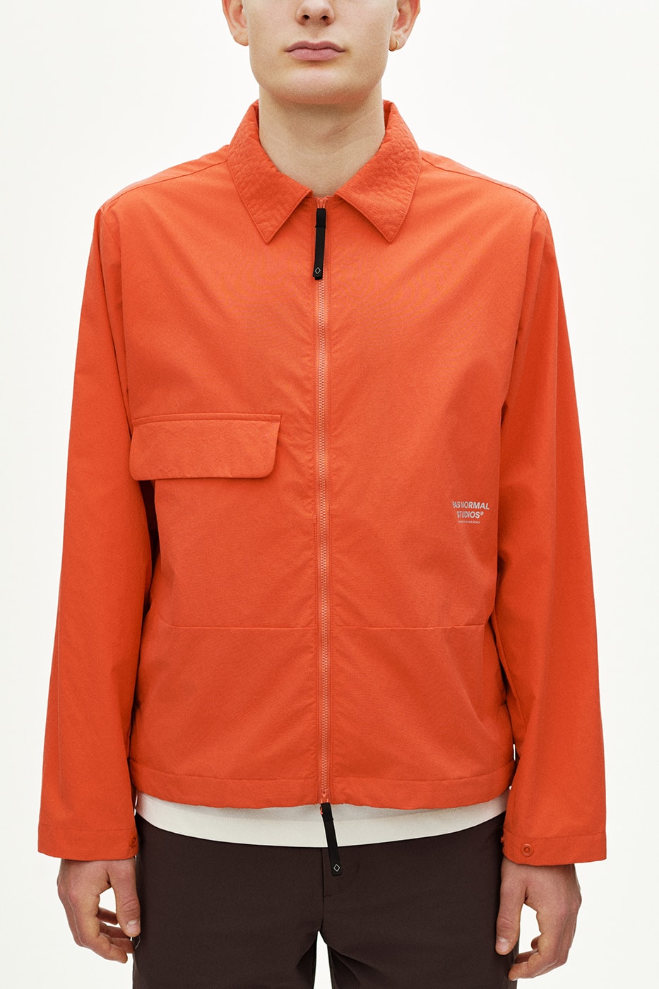 Pas Normal Studios SS26 Off-Race blends cycling utility with everyday style, featuring Polartec® fleece and waterproof commuters.