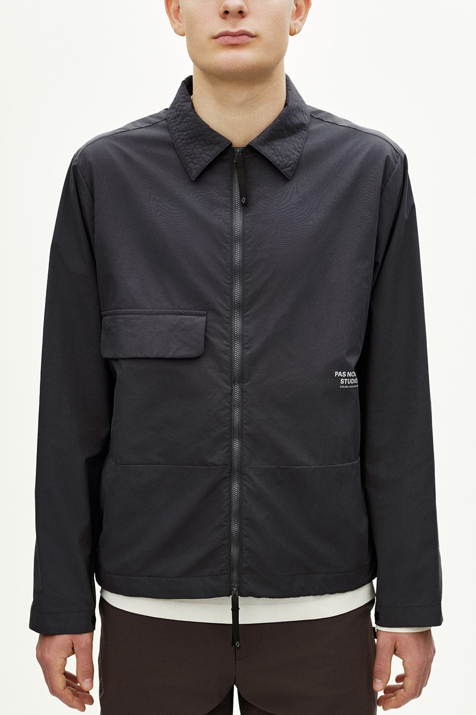 Pas Normal Studios SS26 Off-Race blends cycling utility with everyday style, featuring Polartec® fleece and waterproof commuters.