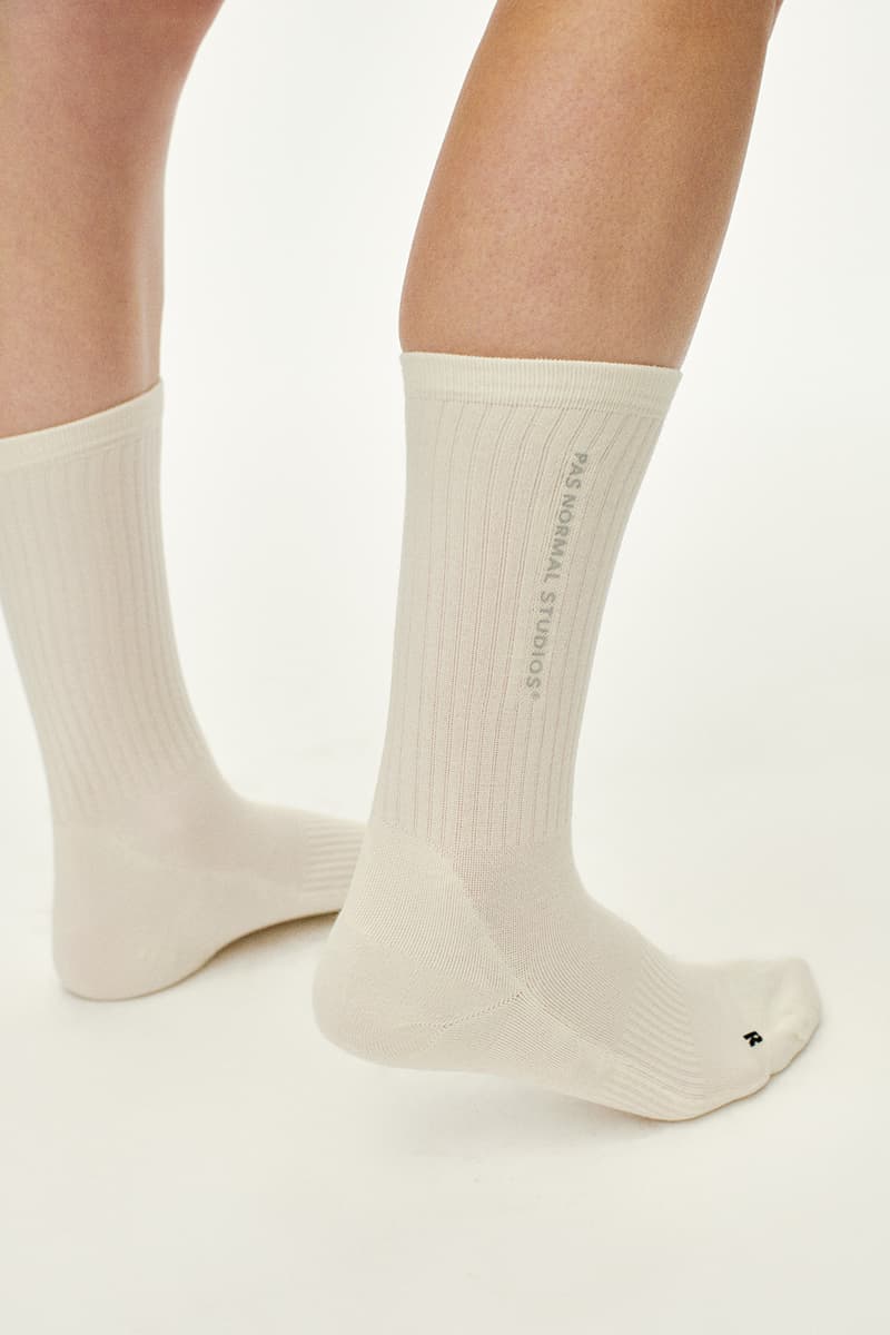 Pas Normal Studios SS26 Off-Race blends cycling utility with everyday style, featuring Polartec® fleece and waterproof commuters.