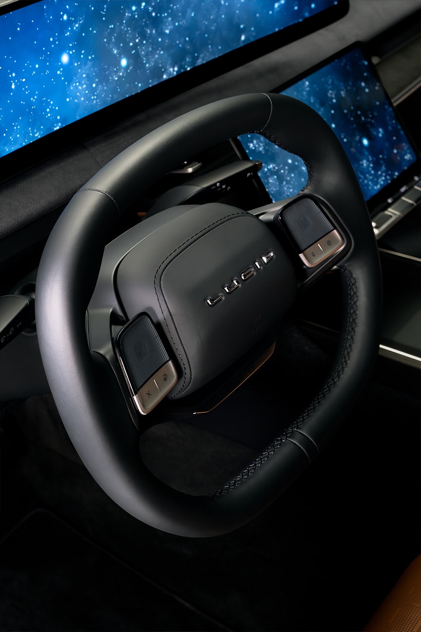 lucid gravity electric vehicle suv seven seater berlin seven suite touring grand living space frunk floating screens leather seats massage 