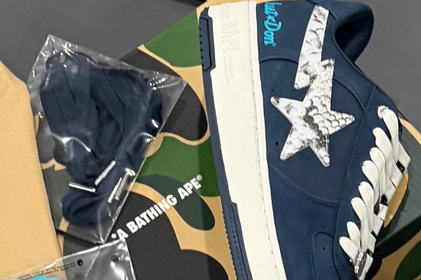Don C Teases Upcoming Just Don x BAPE STA "Python Pack" navy blue white snakeskin sneakers hats apparel accessories collaboration teaser preview