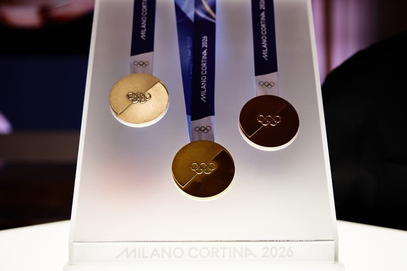 Milano Cortina 2026 Winter Olympics medals shown on ribbons amid reports of cracked and detached hardware.