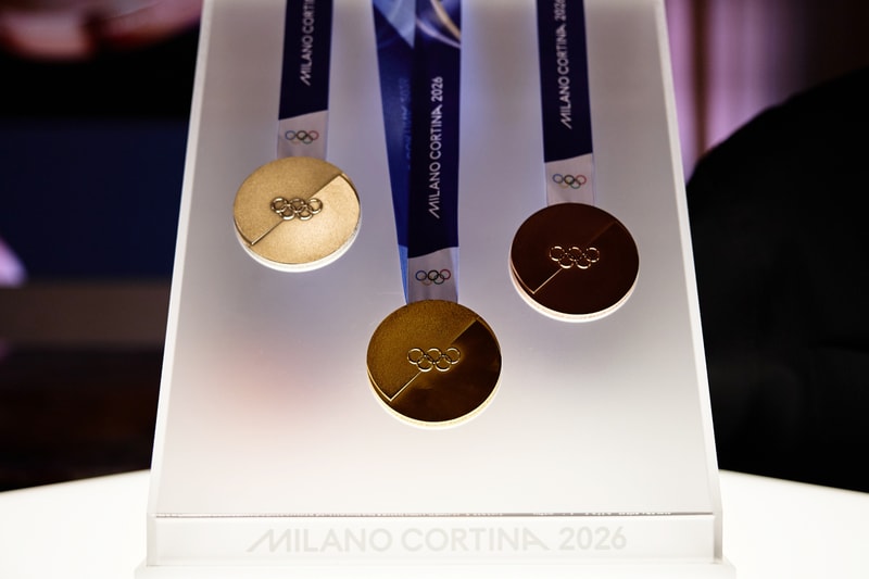 Milano Cortina 2026 Winter Olympics medals shown on ribbons amid reports of cracked and detached hardware.
