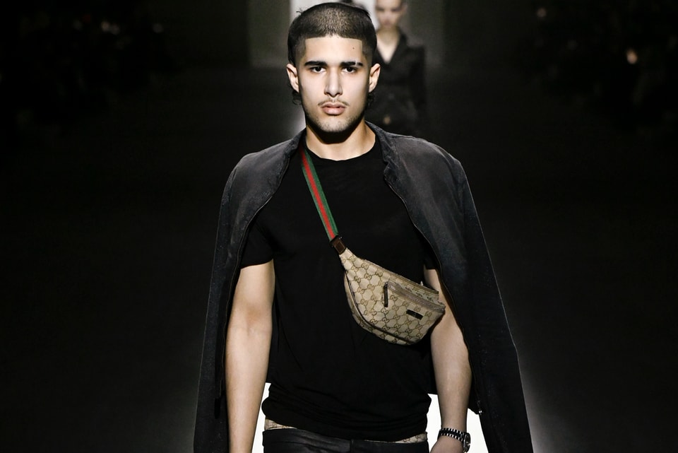 fakemink walking the Gucci runway with phone in hand