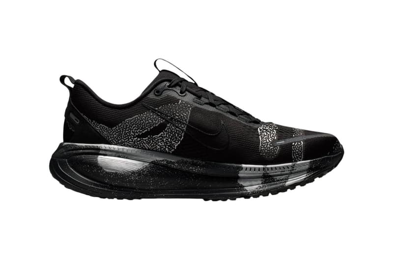 Nike Vomero 18 DSRPT in Iron Grey, Light Smoke Grey, and Black colorway showing abstract two-tone design on running shoe upper - detail view 3