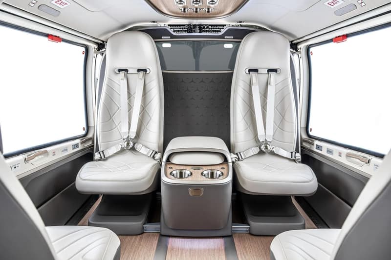 ACH145 Mercedes-Benz Edition helicopter interior featuring EQS and Maybach-inspired leather lounge cabin with wood flooring