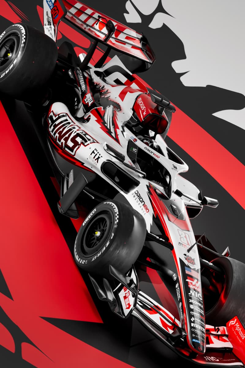 Haas F1 car in Godzilla-themed livery promoting Godzilla Minus Zero at the 2026 Japanese Grand Prix