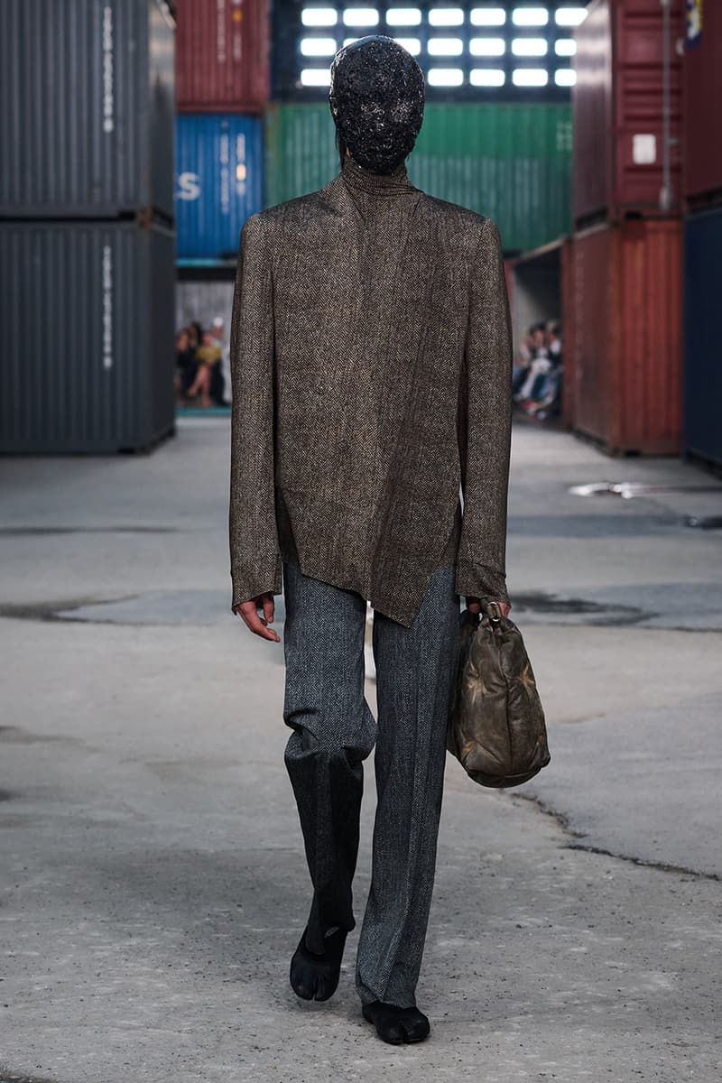 Maison Margiela FW26 Shanghai Fashion Week Collection Glenn Martens Maison Margiela FW26 Brings a Parisian Flea Market to a Shanghai Shipyard Artisanal ready to wear