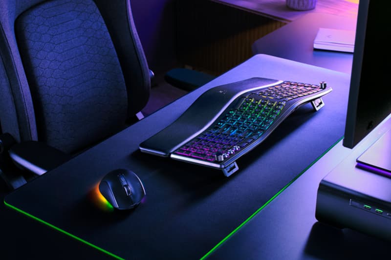Razer Pro Type Ergo wireless ergonomic keyboard with split Alice-style layout, wrist rest and RGB lighting on a modern desk setup.