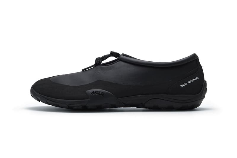 Junya Watanabe MAN x New Balance MT10T in black colorway, side profile showing minimalist design and trail-oriented silhouette - detail view 3