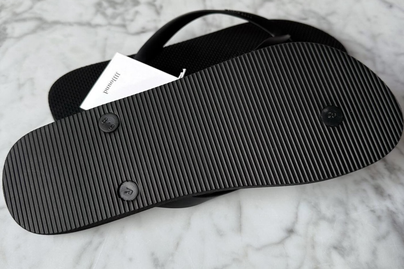 JJJJound Spring/Summer 2026 All-Black Flip-Flops teaser montreal brand minimilaist justin saunders