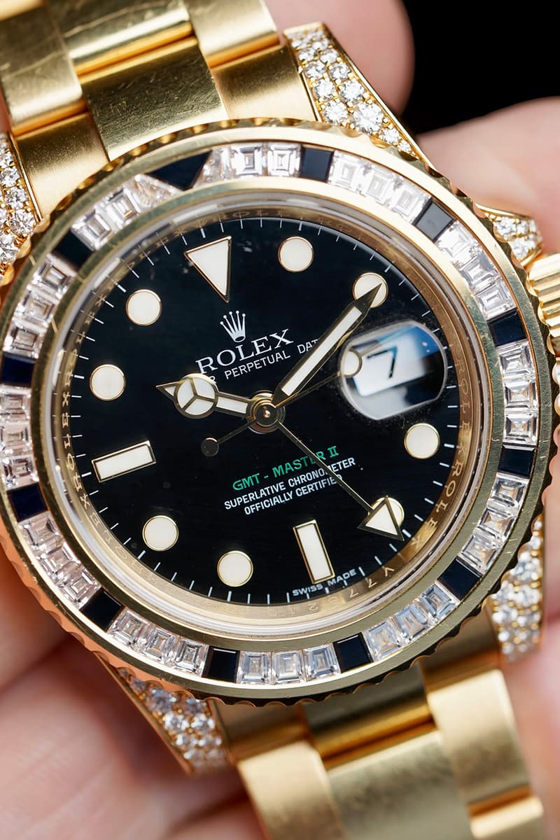 Drake Rolex GMT-Master II in yellow gold with factory baguette diamonds and black sapphires from the Take Care album cover
