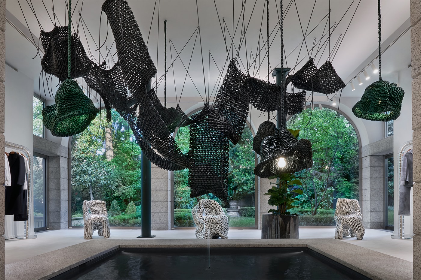Suspended woven forms varying in scale and density within the Bottega Veneta store