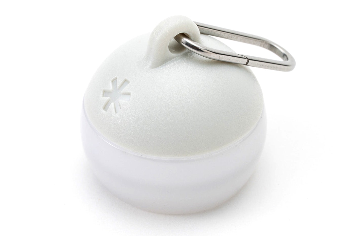 Snow Peak Micro Hozuki mini lantern clipped to a backpack strap, showing compact waterproof LED design
