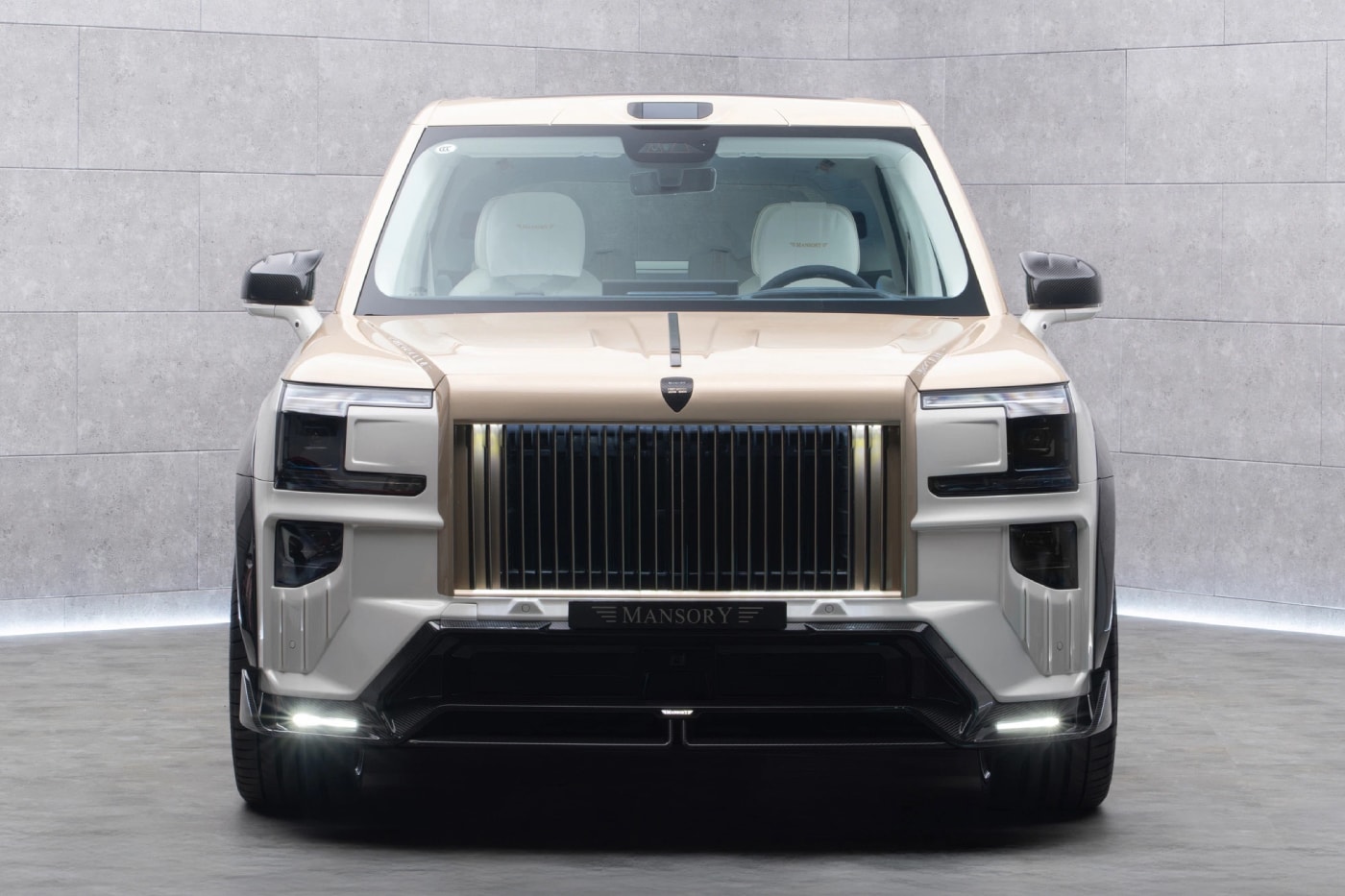 Mansory Zeekr 9X widebody SUV in white and bronze with carbon fiber bodywork at Auto China 2026