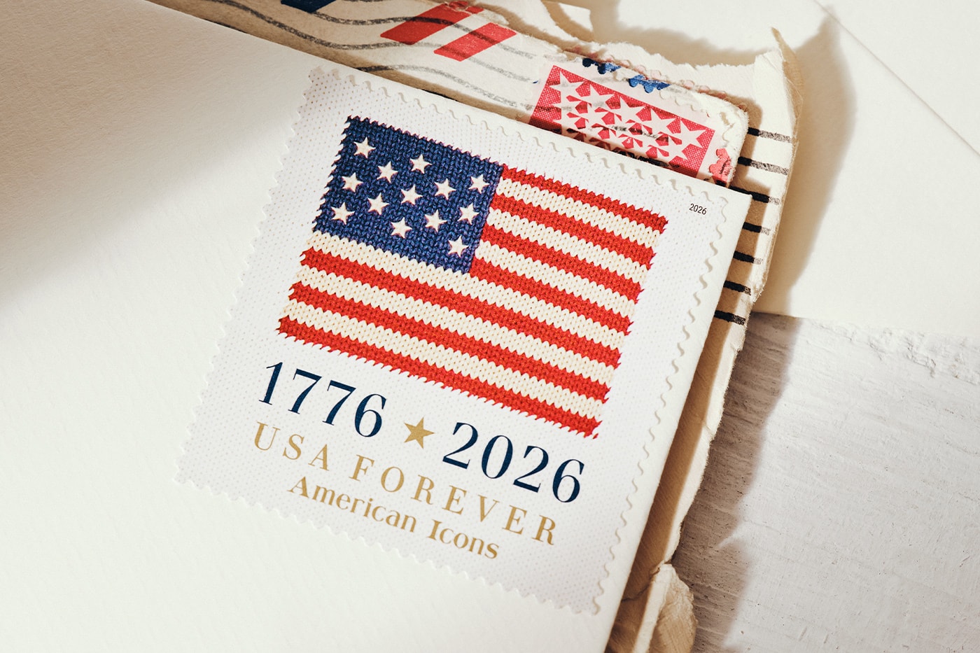 Special Delivery: Ralph Lauren Curates Historic USPS Stamp Collection for America's 250th Anniversary exclusive apparel capsule American Flag Sweater, a classic Polo Shirt, and a tailored Ball Cap united states accessories
