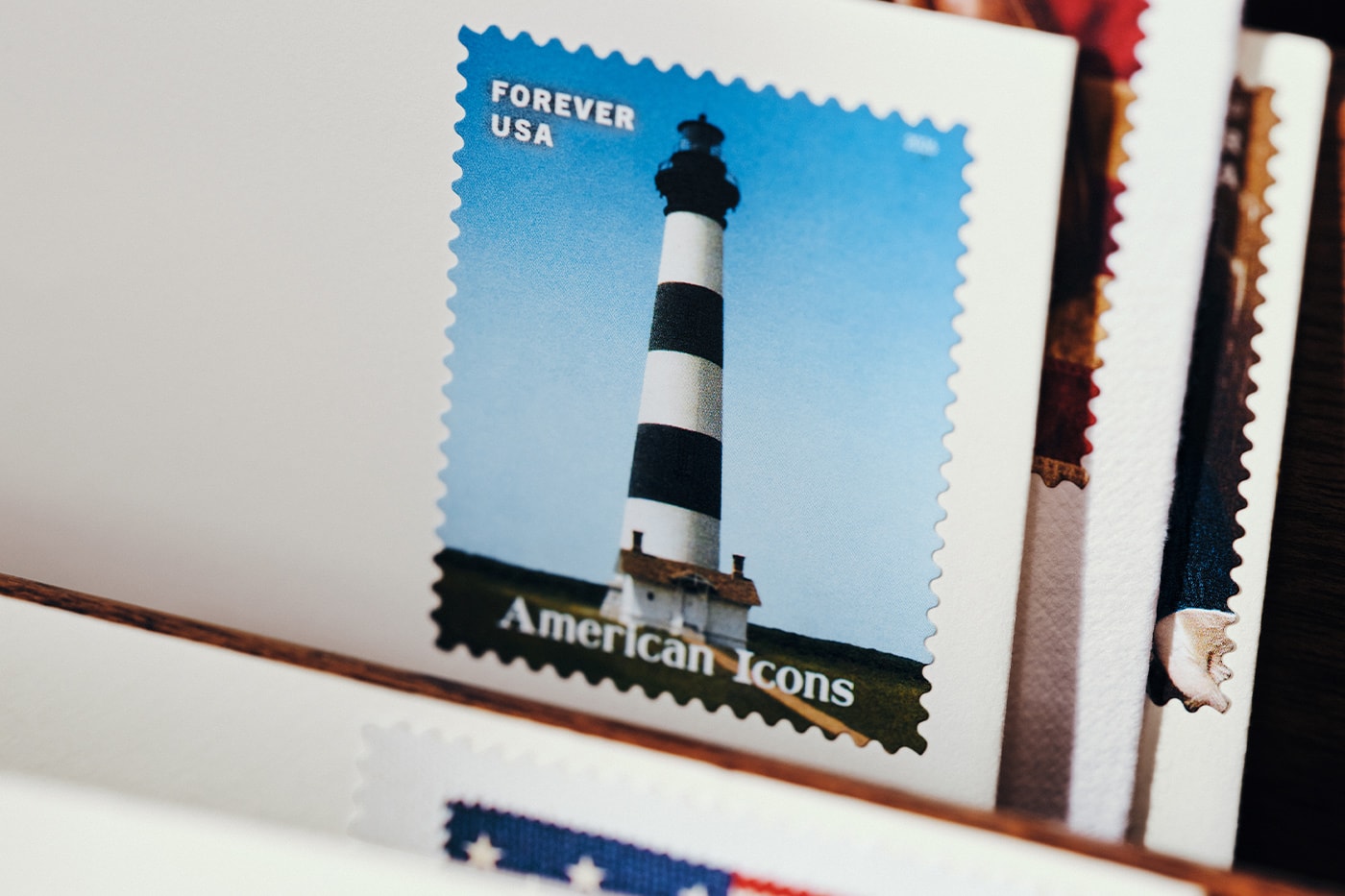 Special Delivery: Ralph Lauren Curates Historic USPS Stamp Collection for America's 250th Anniversary exclusive apparel capsule American Flag Sweater, a classic Polo Shirt, and a tailored Ball Cap united states accessories