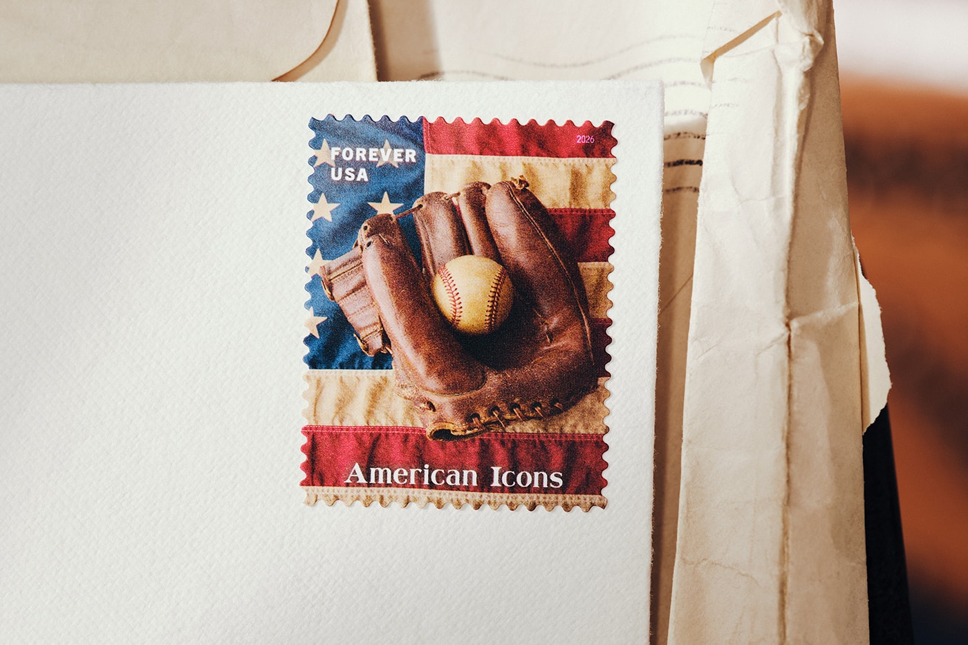 Special Delivery: Ralph Lauren Curates Historic USPS Stamp Collection for America's 250th Anniversary exclusive apparel capsule American Flag Sweater, a classic Polo Shirt, and a tailored Ball Cap united states accessories