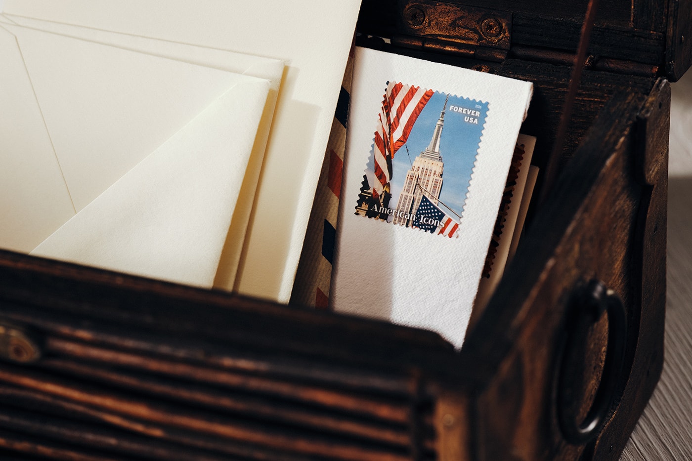 Special Delivery: Ralph Lauren Curates Historic USPS Stamp Collection for America's 250th Anniversary exclusive apparel capsule American Flag Sweater, a classic Polo Shirt, and a tailored Ball Cap united states accessories