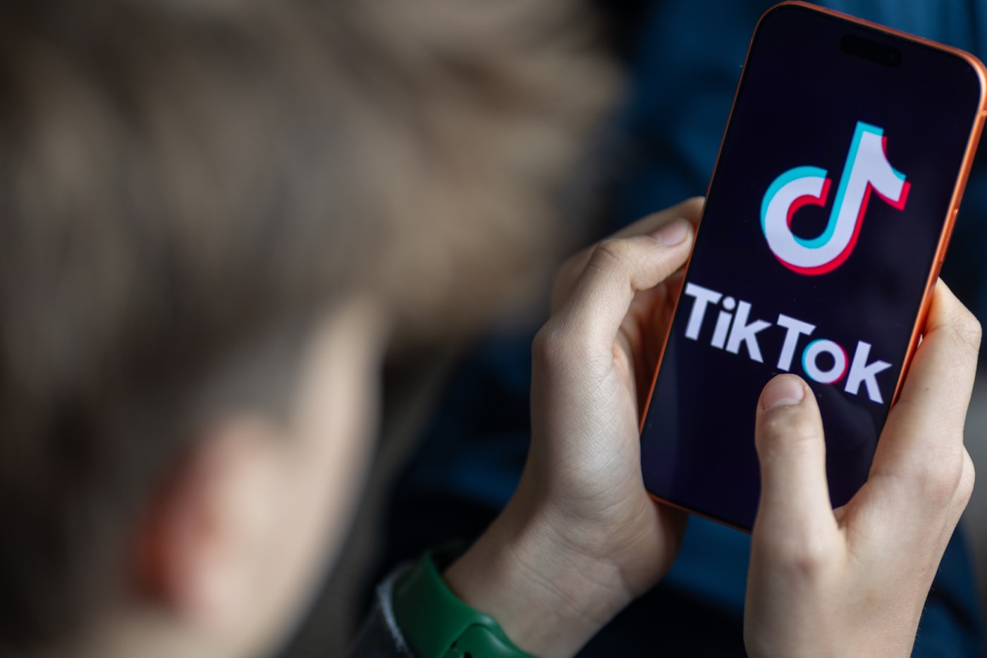 TikTok ad-free subscription screen on a smartphone for UK users