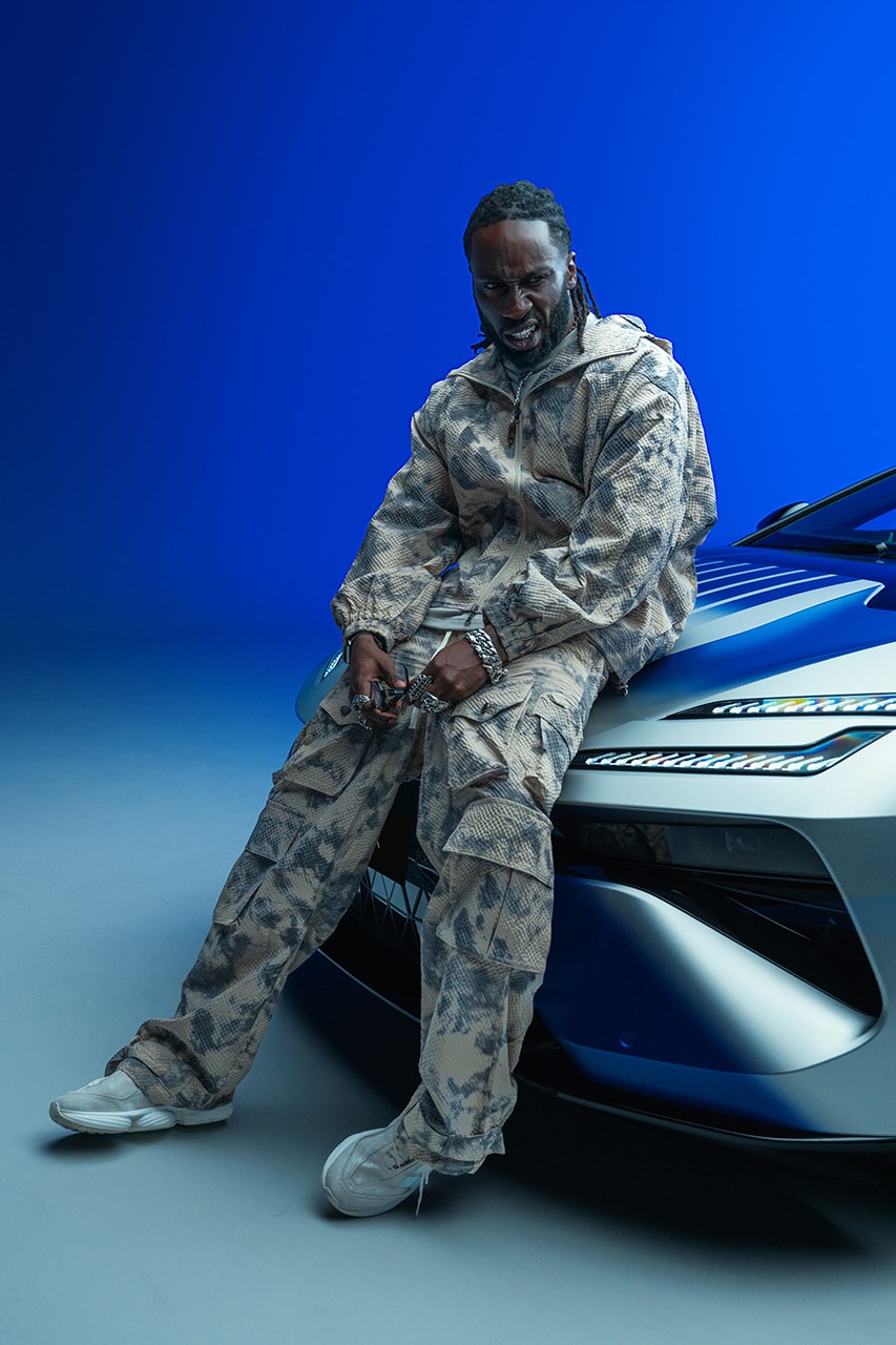 kojey radical lotus Emeya Hyper-GT in Royal Blue music car automotive mayfair london uk collaboration collab partnership royal albert hall album unveiling exclusive interview hypebeast streetwear fashion drop 