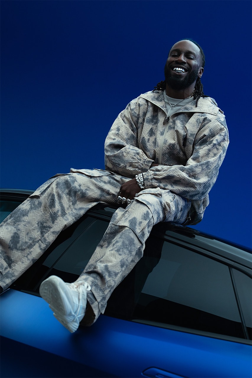 kojey radical lotus Emeya Hyper-GT in Royal Blue music car automotive mayfair london uk collaboration collab partnership royal albert hall album unveiling exclusive interview hypebeast streetwear fashion drop 