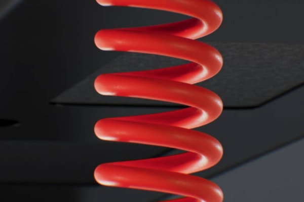 Herman Miller Coyl gaming standing desk with rotary height dial and red coiled power cable