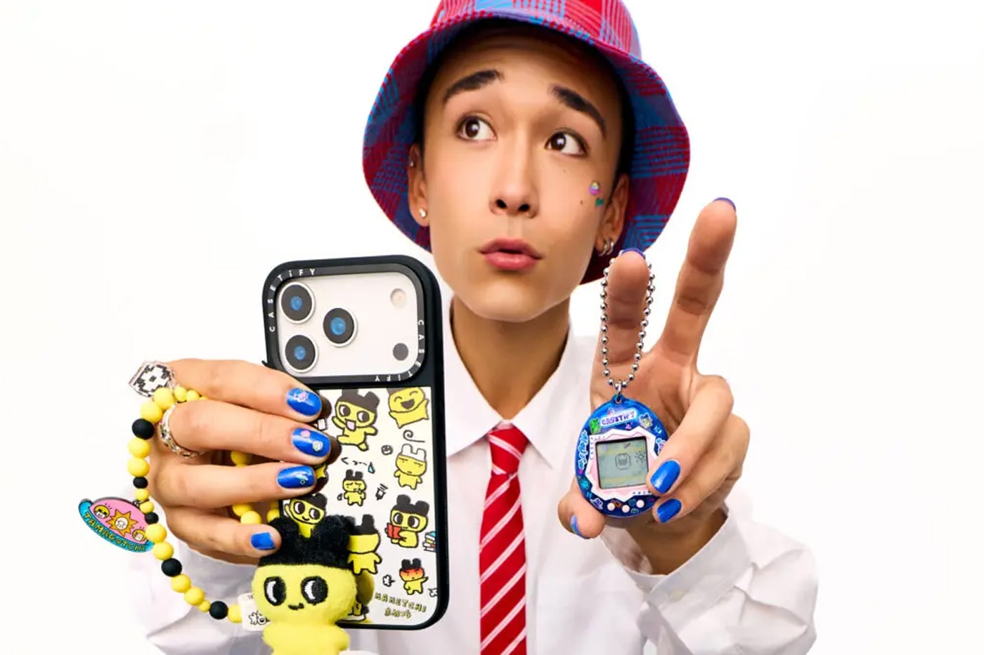 CASETiFY and Tamagotchi Team up for a Retro SS26 Accessories Collection collaboration carry on suitcase phone accessories 