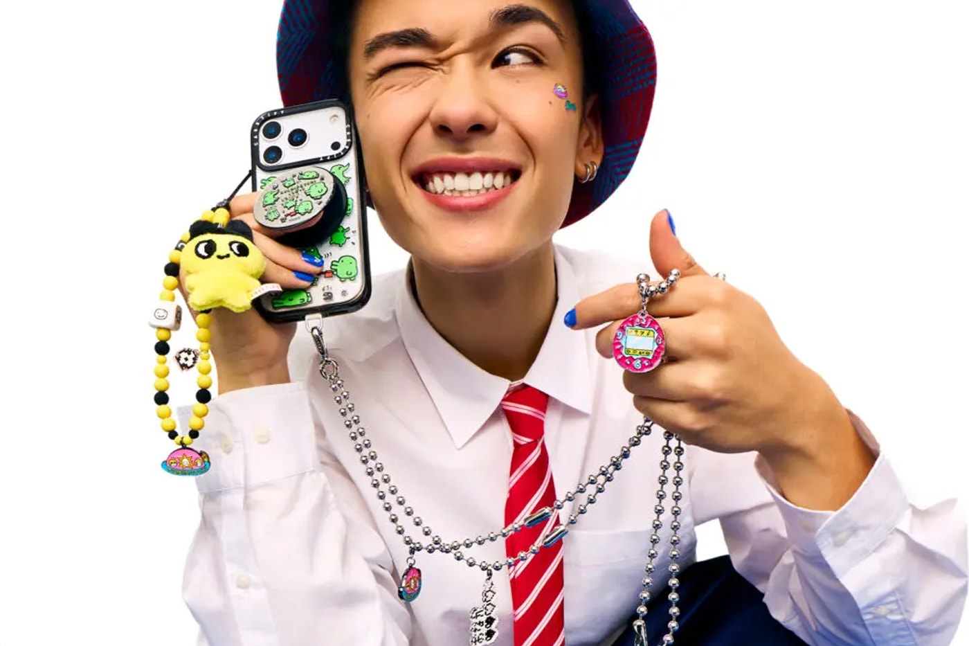 CASETiFY and Tamagotchi Team up for a Retro SS26 Accessories Collection collaboration carry on suitcase phone accessories 