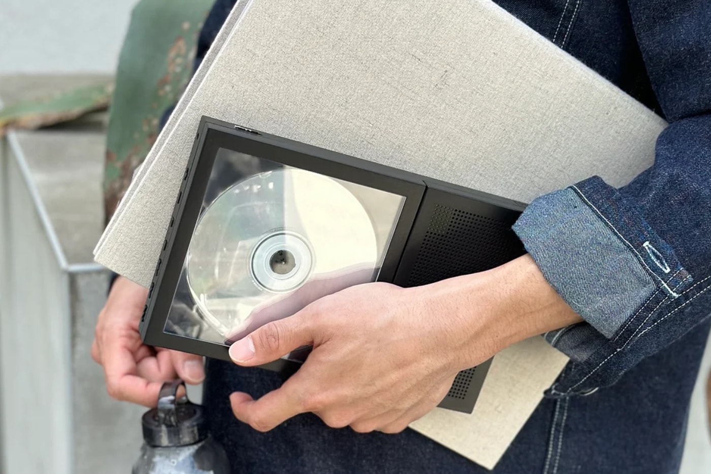 KM5 CP2 Portable CD Cover Player showing a CD case as framed album art