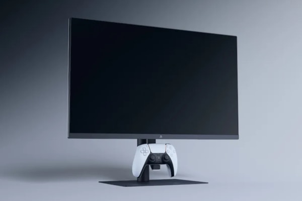 Sony FlexStrike fight stick and 27-inch PlayStation gaming monitor setup on a desktop