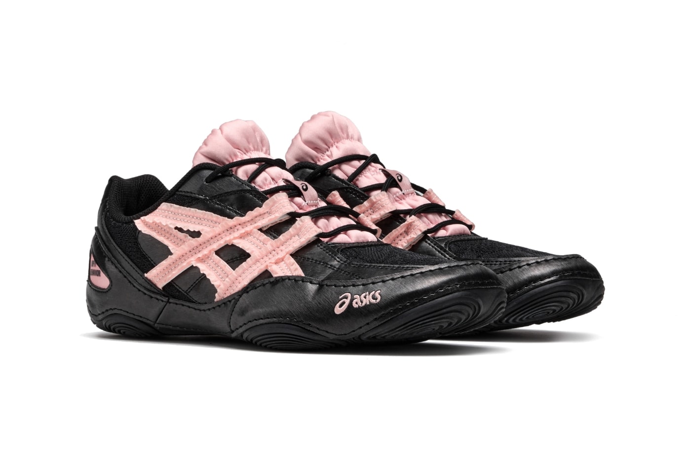 Empty Behavior x ASICS Hypersync Black Breeze 1203B146-001 hero image showing black synthetic leather and mesh upper with ruffled fabric tiger stripe replacement and soft pink accents