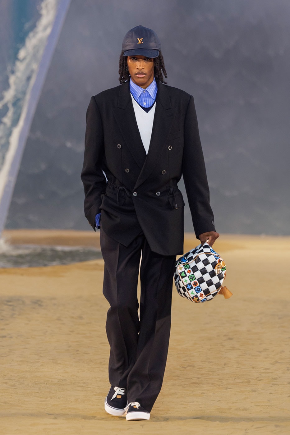 Louis Vuitton SS27 menswear runway show with crashing wave set design