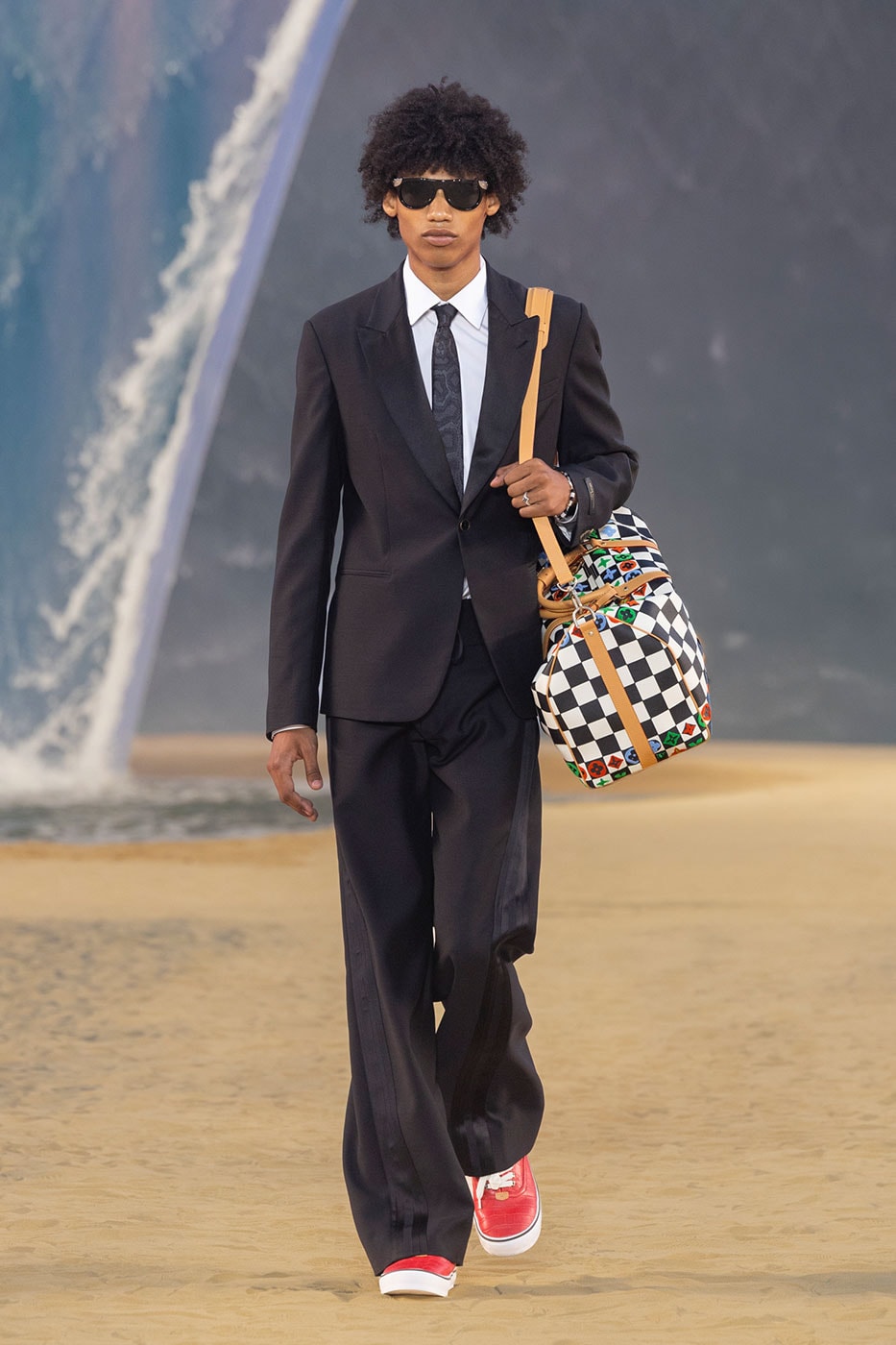 Surf-inflected tailoring and trompe l oeil wetsuit details in the LV SS27 collection