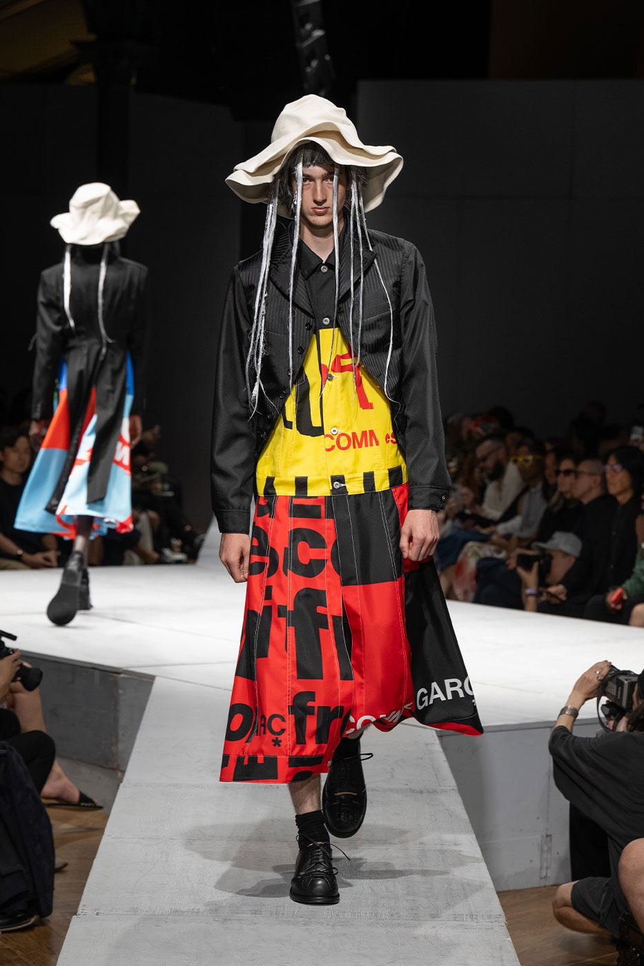 COMME des GARÇONS HOMME PLUS SS27 Debuts Dual-Act Show "If The War Were To End.." rei kawakubo paris fashion week