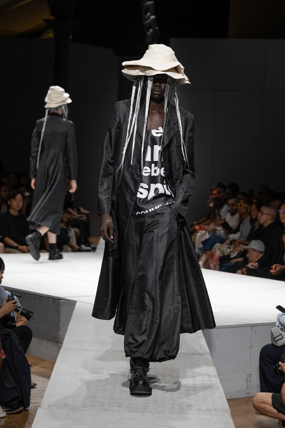 COMME des GARÇONS HOMME PLUS SS27 Debuts Dual-Act Show "If The War Were To End.." rei kawakubo paris fashion week