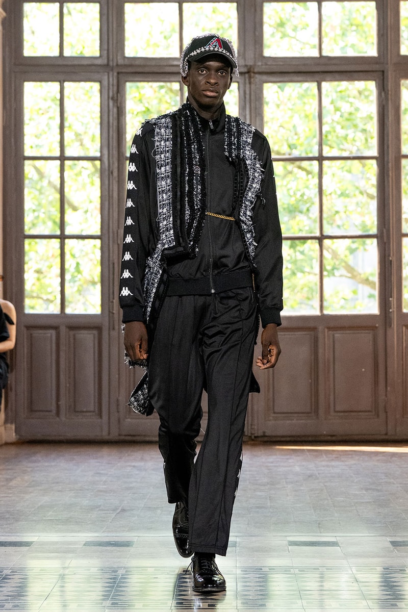 JUNYA WATANABE MAN SS27 Blends Streetwear Icons and Luxury Tailoring Under "BLING BLING BLING" Theme paris fashion week spring summer 2027 runway Kappa  Needles  Carhartt  Levi’s  Luigi Borrelli  Guy Rover  Maria Santangelo  INNERRAUM  47  HIDDEN   Union LA  DHL  Flake  New Balance  Heinrich Dinkelacker  Tricker's 