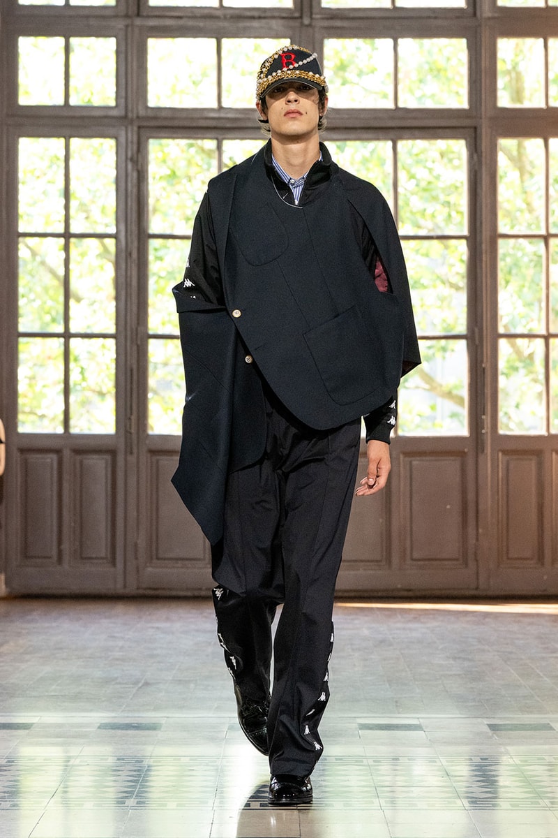 JUNYA WATANABE MAN SS27 Blends Streetwear Icons and Luxury Tailoring Under "BLING BLING BLING" Theme paris fashion week spring summer 2027 runway Kappa  Needles  Carhartt  Levi’s  Luigi Borrelli  Guy Rover  Maria Santangelo  INNERRAUM  47  HIDDEN   Union LA  DHL  Flake  New Balance  Heinrich Dinkelacker  Tricker's 