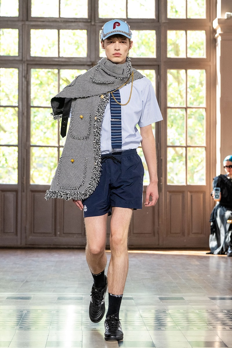 JUNYA WATANABE MAN SS27 Blends Streetwear Icons and Luxury Tailoring Under "BLING BLING BLING" Theme paris fashion week spring summer 2027 runway Kappa  Needles  Carhartt  Levi’s  Luigi Borrelli  Guy Rover  Maria Santangelo  INNERRAUM  47  HIDDEN   Union LA  DHL  Flake  New Balance  Heinrich Dinkelacker  Tricker's 
