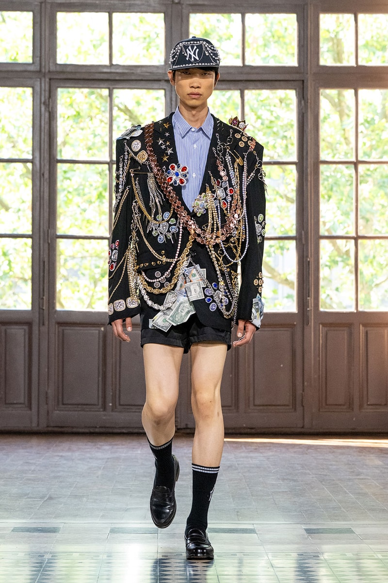 JUNYA WATANABE MAN SS27 Blends Streetwear Icons and Luxury Tailoring Under "BLING BLING BLING" Theme paris fashion week spring summer 2027 runway Kappa  Needles  Carhartt  Levi’s  Luigi Borrelli  Guy Rover  Maria Santangelo  INNERRAUM  47  HIDDEN   Union LA  DHL  Flake  New Balance  Heinrich Dinkelacker  Tricker's 