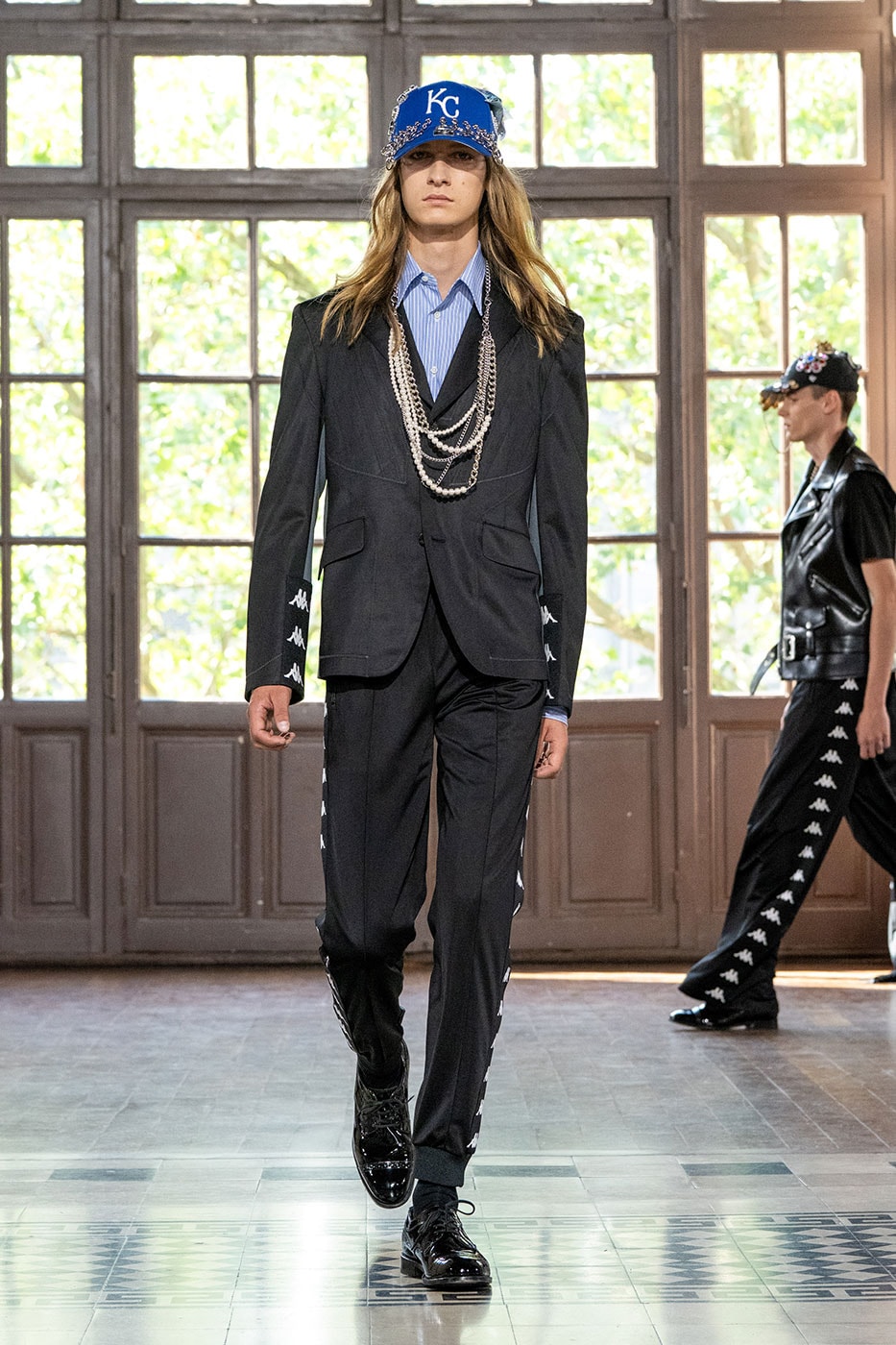 JUNYA WATANABE MAN SS27 Blends Streetwear Icons and Luxury Tailoring Under "BLING BLING BLING" Theme paris fashion week spring summer 2027 runway Kappa  Needles  Carhartt  Levi’s  Luigi Borrelli  Guy Rover  Maria Santangelo  INNERRAUM  47  HIDDEN   Union LA  DHL  Flake  New Balance  Heinrich Dinkelacker  Tricker's 