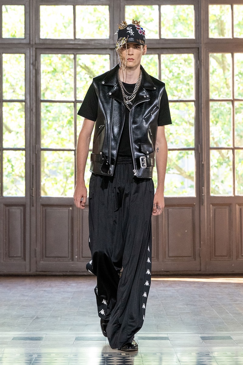 JUNYA WATANABE MAN SS27 Blends Streetwear Icons and Luxury Tailoring Under "BLING BLING BLING" Theme paris fashion week spring summer 2027 runway Kappa  Needles  Carhartt  Levi’s  Luigi Borrelli  Guy Rover  Maria Santangelo  INNERRAUM  47  HIDDEN   Union LA  DHL  Flake  New Balance  Heinrich Dinkelacker  Tricker's 