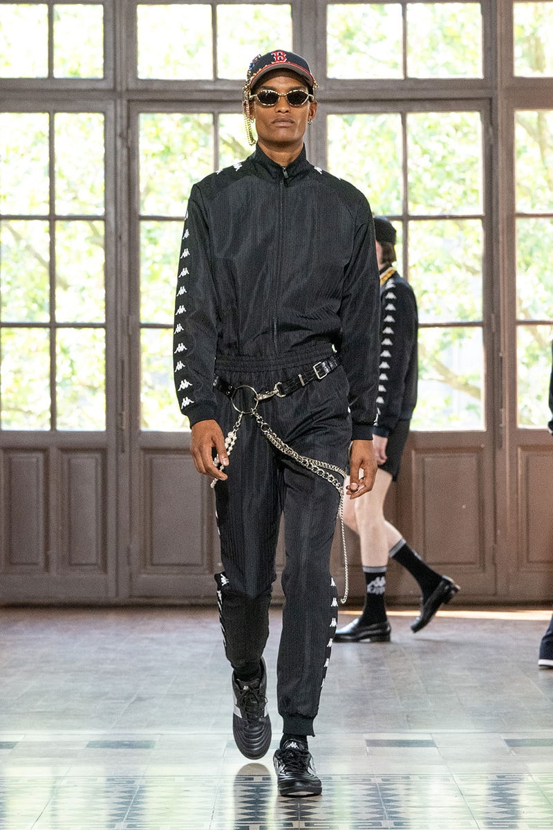 JUNYA WATANABE MAN SS27 Blends Streetwear Icons and Luxury Tailoring Under "BLING BLING BLING" Theme paris fashion week spring summer 2027 runway Kappa  Needles  Carhartt  Levi’s  Luigi Borrelli  Guy Rover  Maria Santangelo  INNERRAUM  47  HIDDEN   Union LA  DHL  Flake  New Balance  Heinrich Dinkelacker  Tricker's 