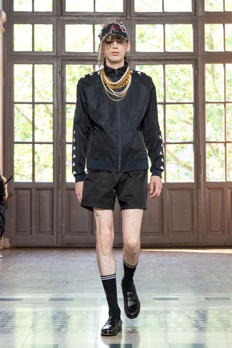 JUNYA WATANABE MAN SS27 Blends Streetwear Icons and Luxury Tailoring Under "BLING BLING BLING" Theme paris fashion week spring summer 2027 runway Kappa  Needles  Carhartt  Levi’s  Luigi Borrelli  Guy Rover  Maria Santangelo  INNERRAUM  47  HIDDEN   Union LA  DHL  Flake  New Balance  Heinrich Dinkelacker  Tricker's 