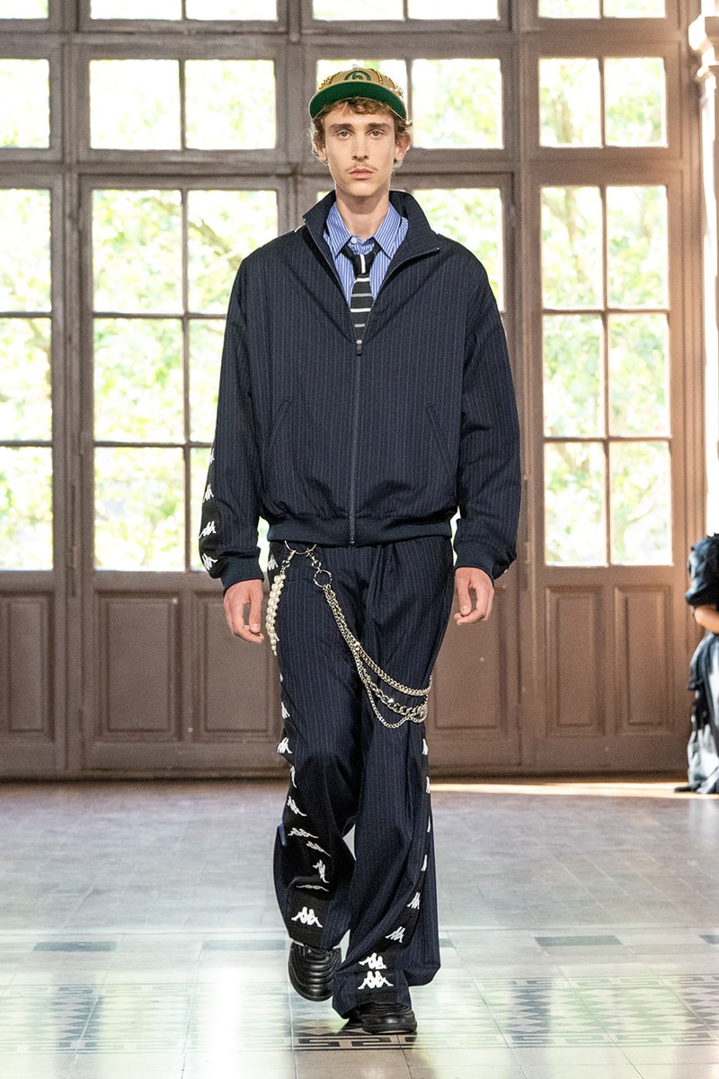 JUNYA WATANABE MAN SS27 Blends Streetwear Icons and Luxury Tailoring Under "BLING BLING BLING" Theme paris fashion week spring summer 2027 runway Kappa  Needles  Carhartt  Levi’s  Luigi Borrelli  Guy Rover  Maria Santangelo  INNERRAUM  47  HIDDEN   Union LA  DHL  Flake  New Balance  Heinrich Dinkelacker  Tricker's 